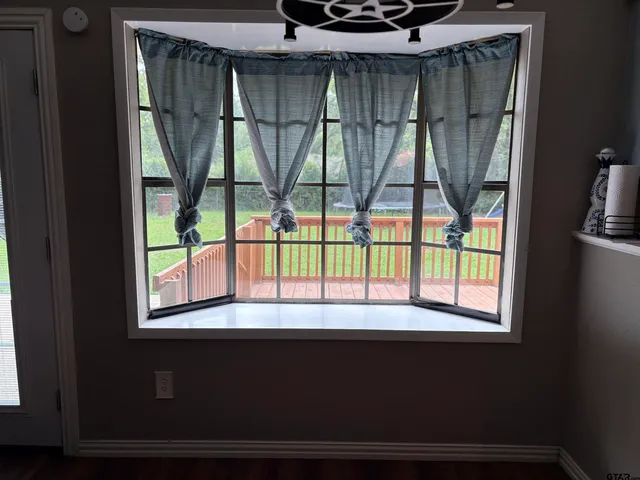 a kitchen with granite countertop a sink stove and refrigerator
