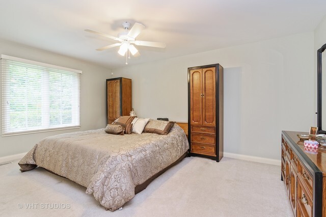 20 Lochbrook Lane Inverness, IL 60010 - Photo 9 of 27 a bedroom with a bed and a chandelier