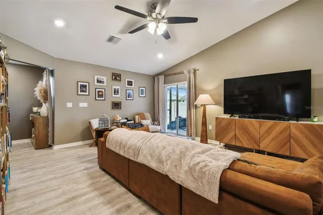 a living room with a flat screen tv and a couch