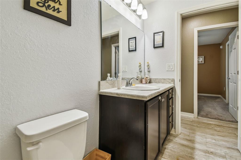 105 Blue Alice Spring Court Ruskin, FL 33570 - Photo 33 of 49 a bathroom with a sink and a toilet