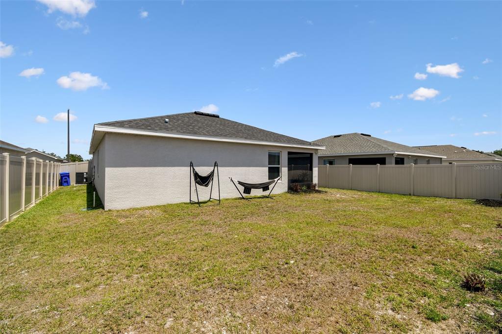 105 Blue Alice Spring Court Ruskin, FL 33570 - Photo 43 of 49 a front view of a house with a yard