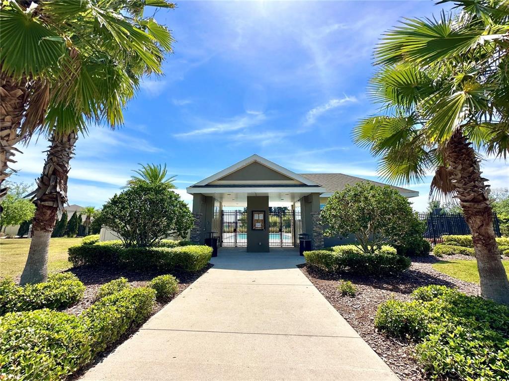 105 Blue Alice Spring Court Ruskin, FL 33570 - Photo 45 of 49 a front view of a house with a garden