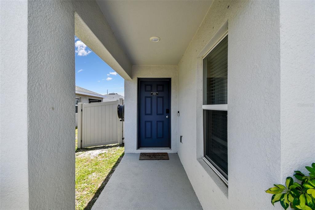 105 Blue Alice Spring Court Ruskin, FL 33570 - Photo 6 of 49 a view of front door and bedroom