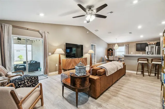 a living room with furniture fireplace and a flat screen tv