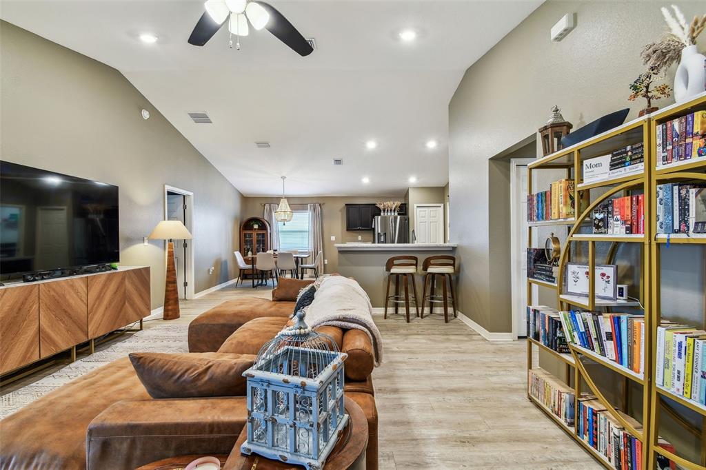 105 Blue Alice Spring Court Ruskin, FL 33570 - Photo 9 of 49 a living room with furniture lots of furniture and a flat screen tv