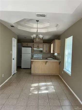 a bathroom with a granite countertop toilet and a sink