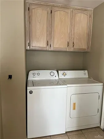 a kitchen with kitchen island a stove a sink and a refrigerator