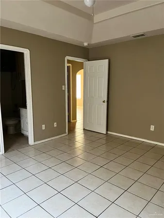 a kitchen with kitchen island stainless steel appliances granite countertop a sink a stove and a refrigerator