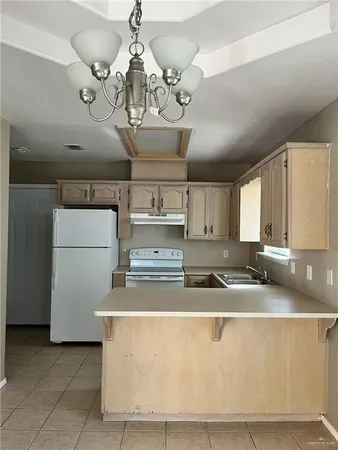 a view of an empty room and a window