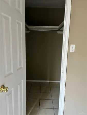 a view of a livingroom with an empty space and a window