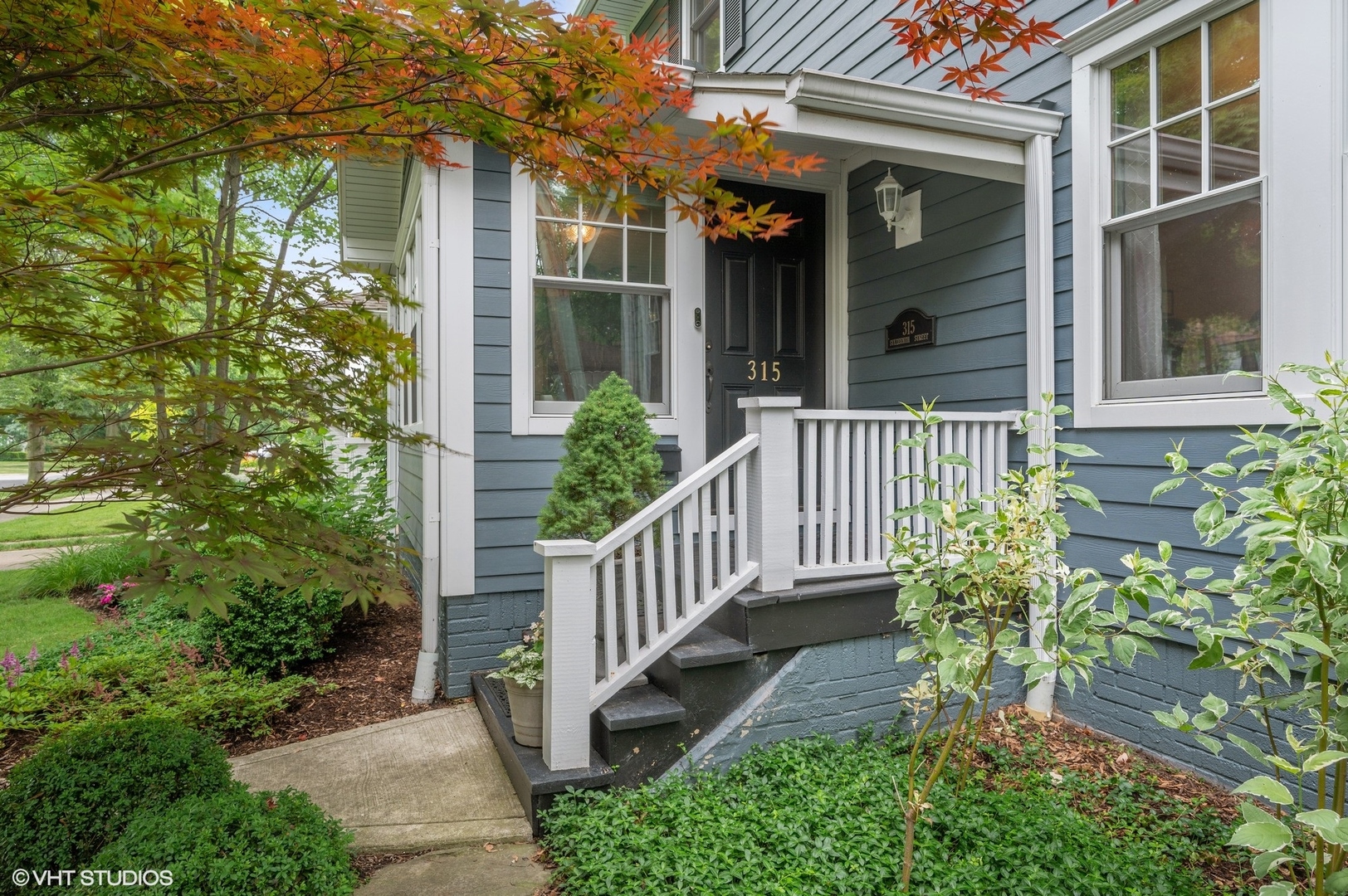 315 16th Street Wilmette, IL 60091 - Photo 2 of 31 a view of a house with brick walls and flower plants