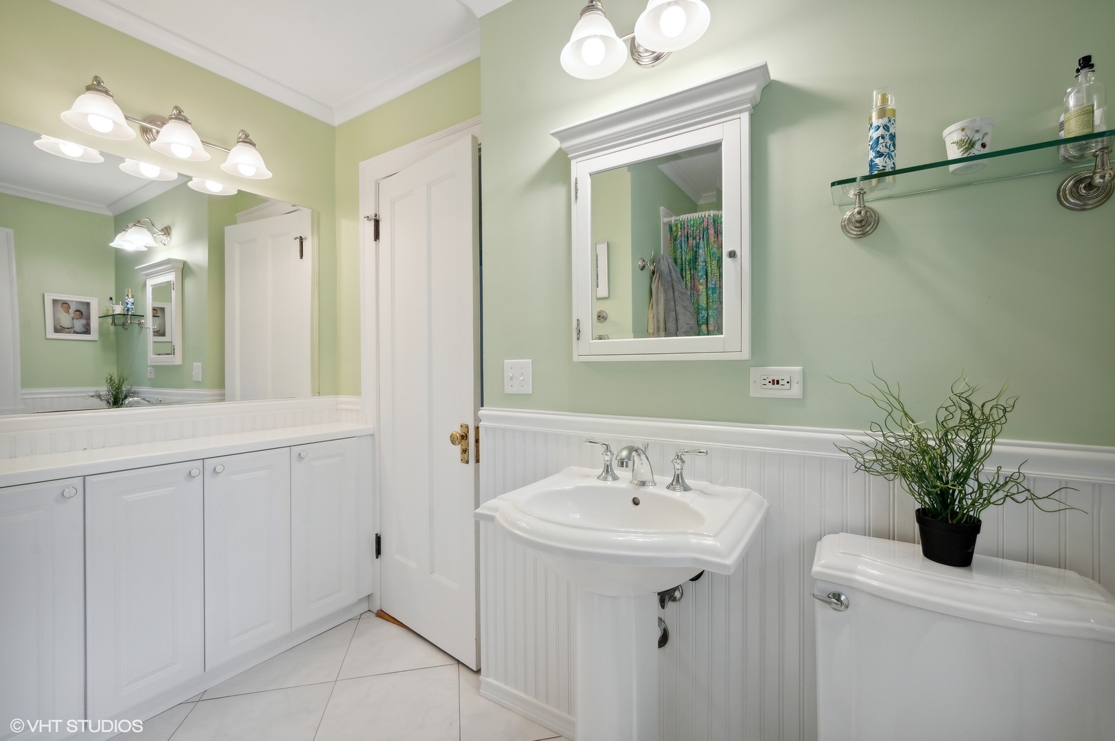 315 16th Street Wilmette, IL 60091 - Photo 22 of 31 a bathroom with a sink a toilet and mirror
