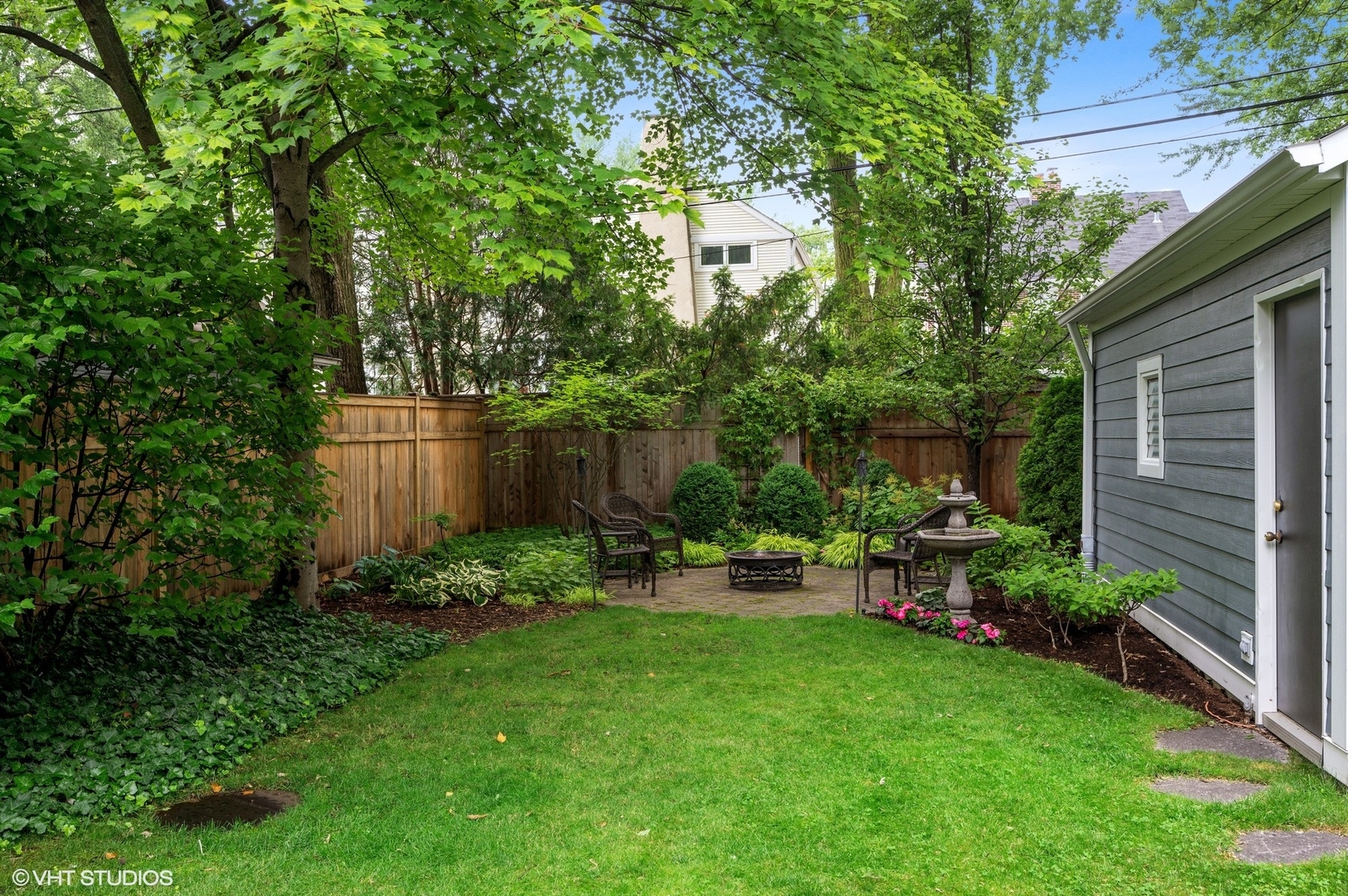 315 16th Street Wilmette, IL 60091 - Photo 25 of 31 a view of backyard with table and chairs and potted plants and large trees