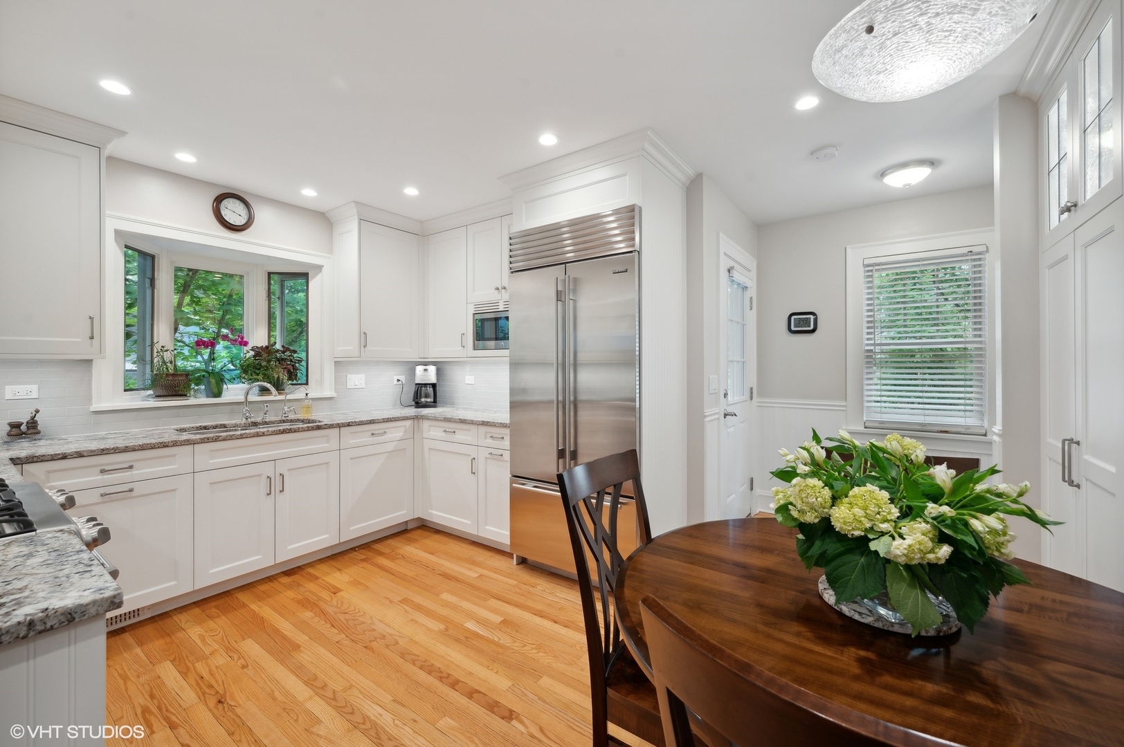 315 16th Street Wilmette, IL 60091 - Photo 5 of 31 a kitchen with stainless steel appliances granite countertop sink stove and refrigerator