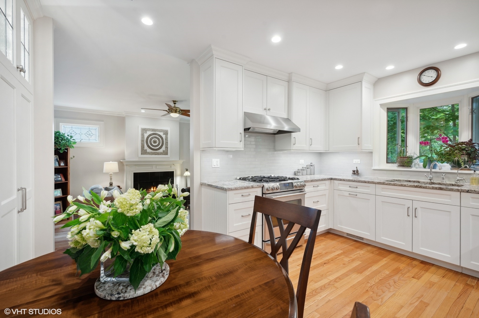 315 16th Street Wilmette, IL 60091 - Photo 6 of 31 a kitchen with stainless steel appliances granite countertop a white cabinets stove a sink and a microwave