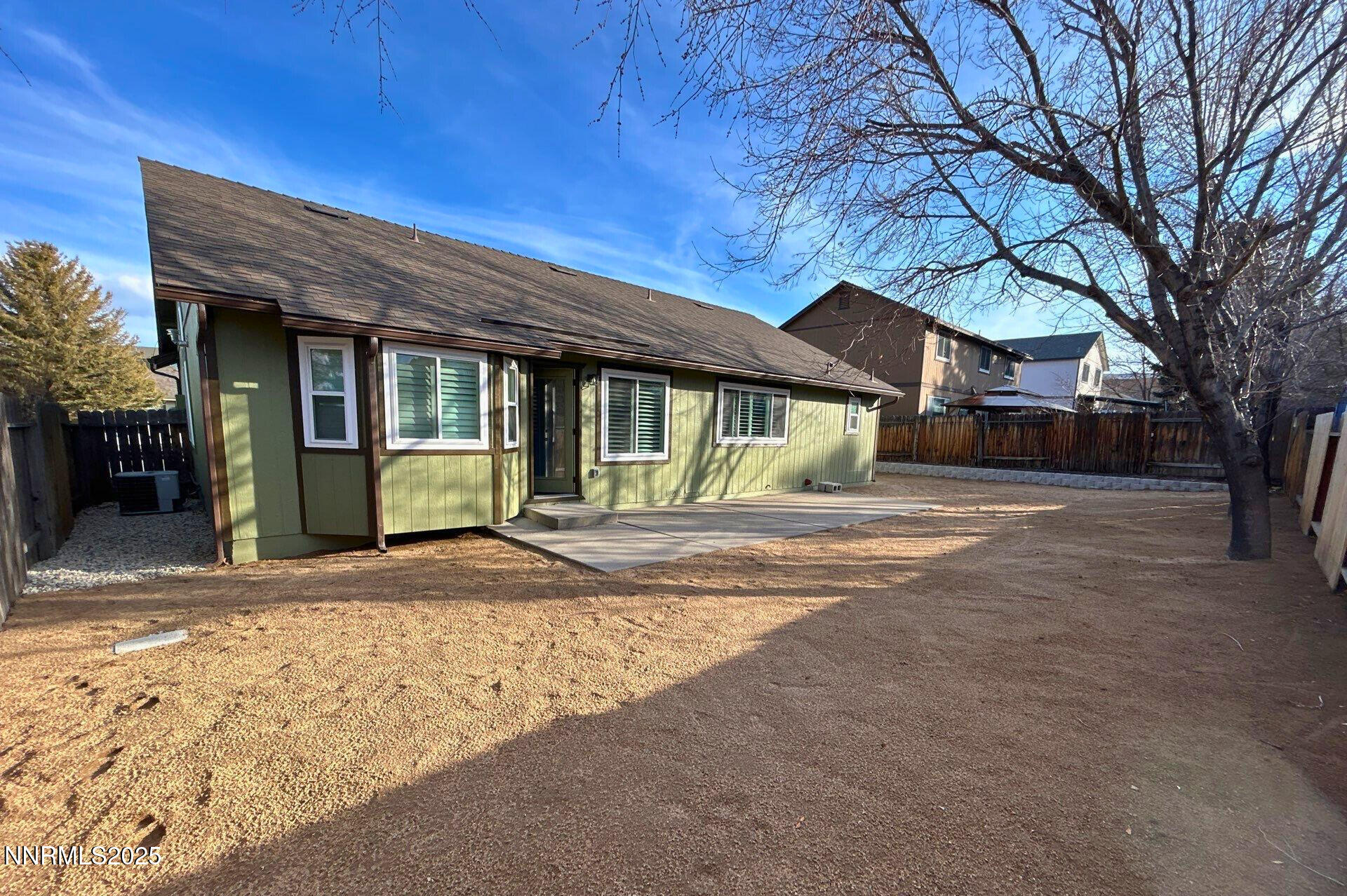 8657 Silver Shores Drive Reno, NV 89506 - Photo 11 of 12 a front view of a house with a yard