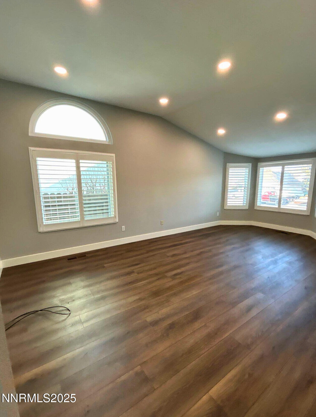 8657 Silver Shores Drive Reno, NV 89506 - Photo 4 of 12 an empty room with wooden floor and windows