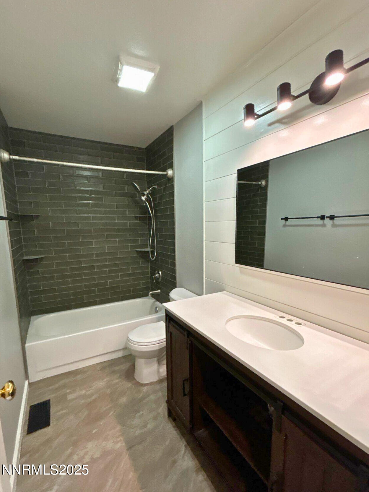 8657 Silver Shores Drive Reno, NV 89506 - Photo 9 of 12 a bathroom with a sink a toilet and shower