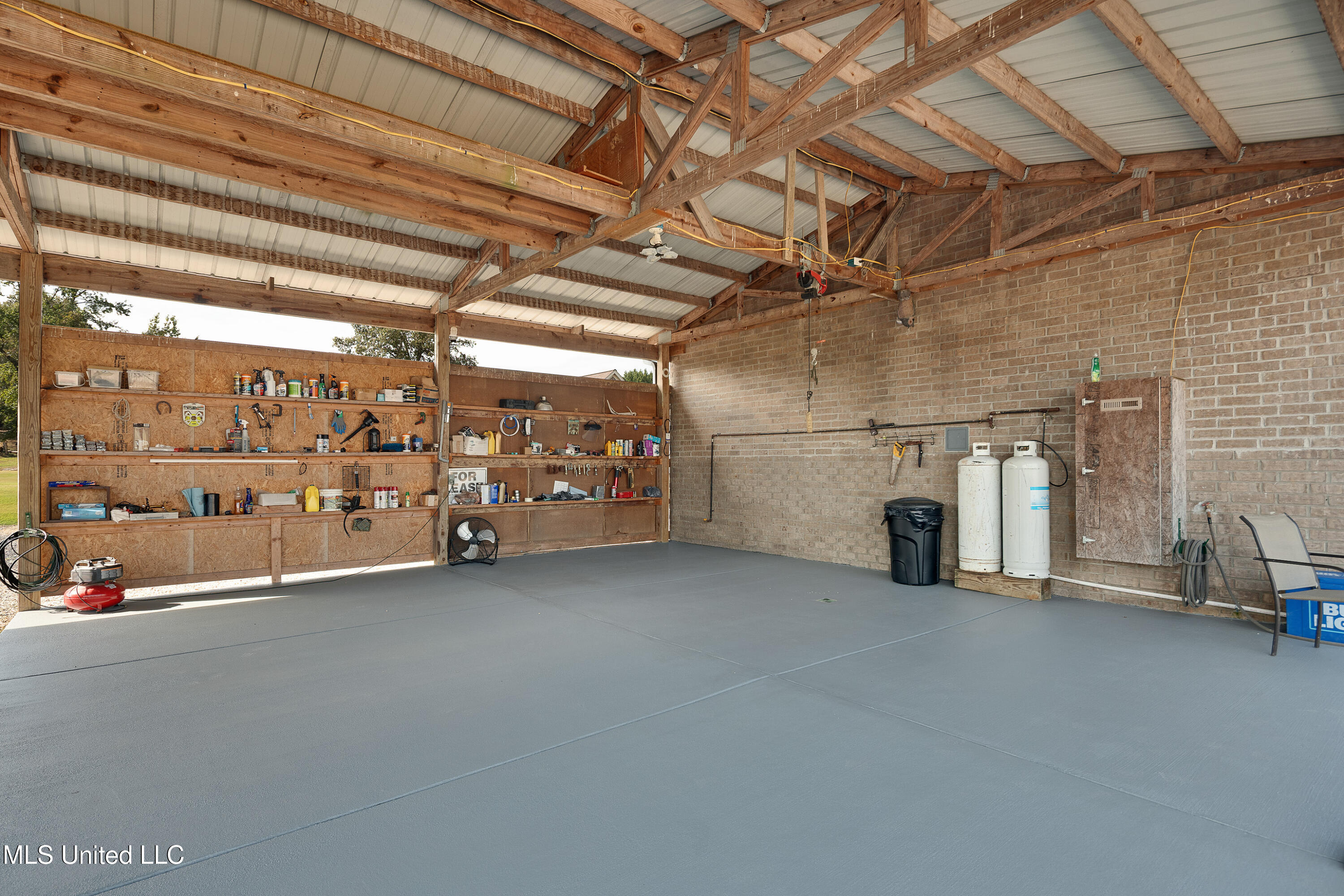 1778 Sunset Farms Drive Hernando, MS 38632 - Photo 56 of 64 Open barn/carport concrete pad area