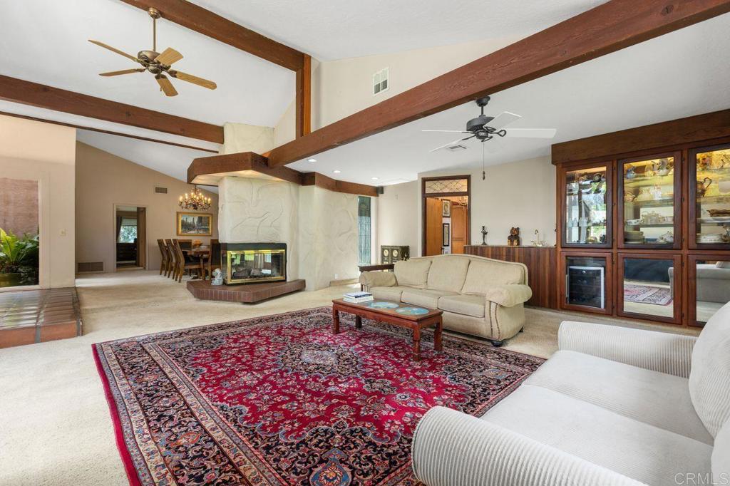 29560 Lilac Road Valley Center, CA 92082 - Photo 42 of 43 a living room with furniture and a fireplace