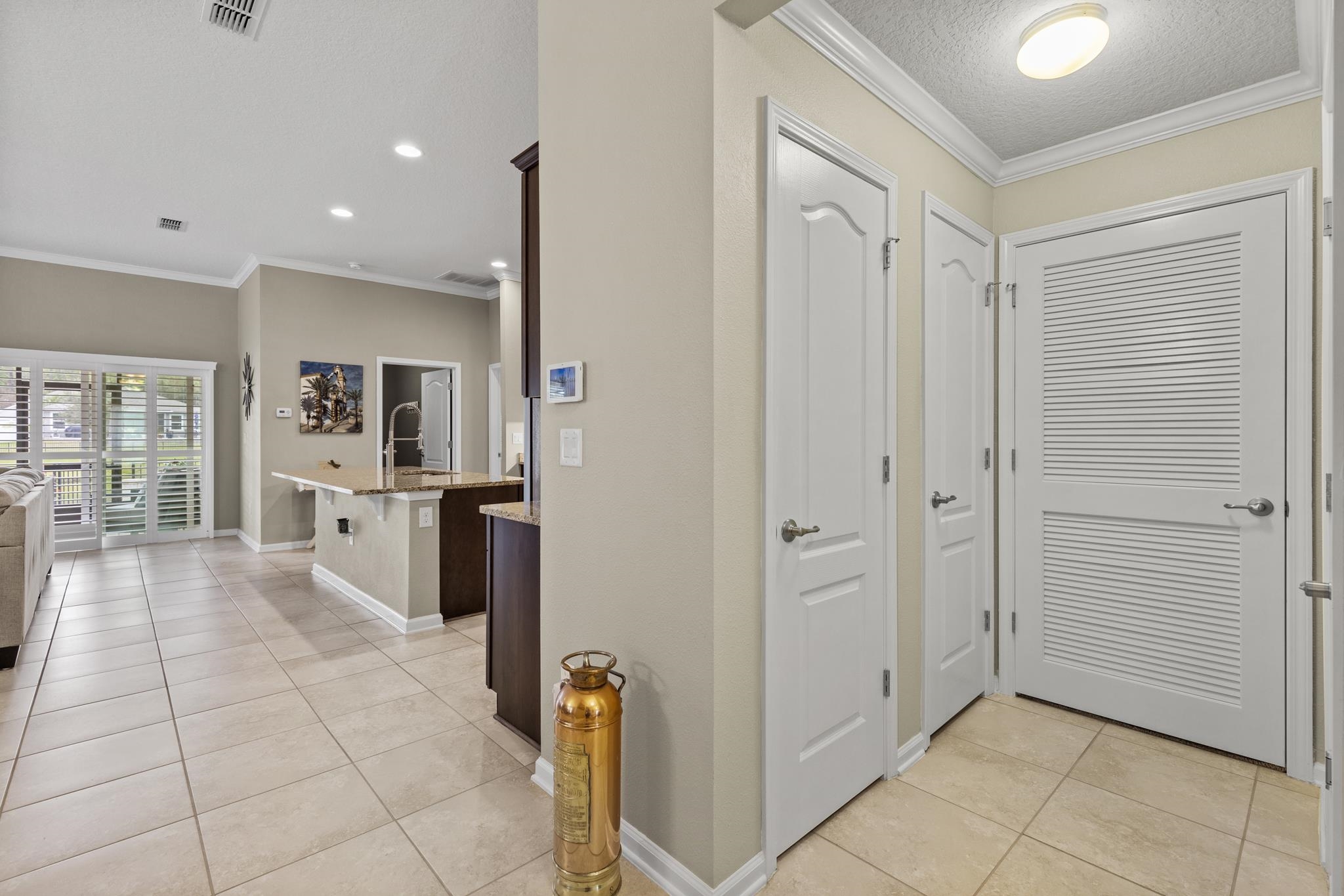 307 Palace Drive St. Augustine, FL 32084 - Photo 12 of 58 a view of a kitchen with a refrigerator and a sink