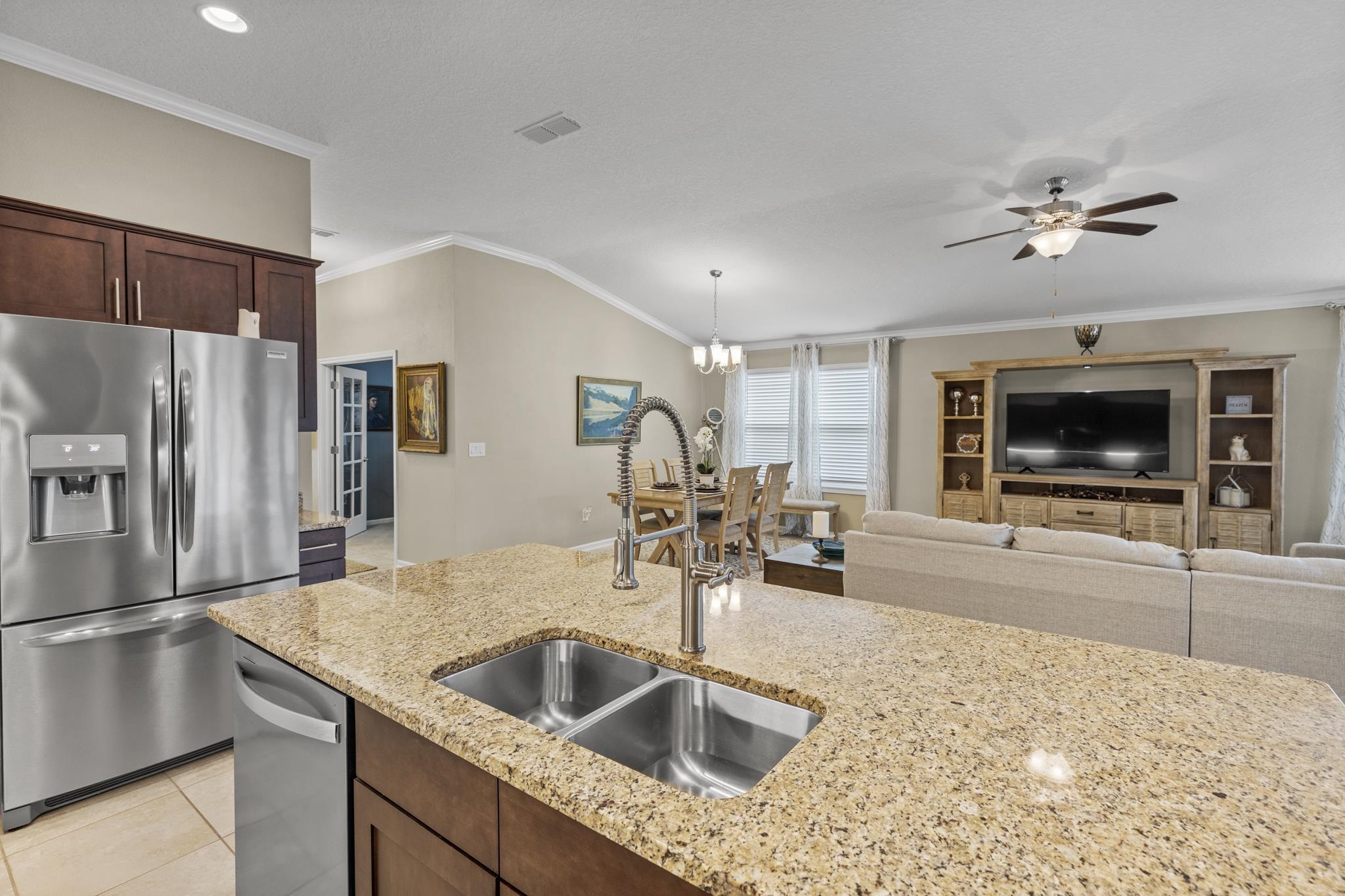 307 Palace Drive St. Augustine, FL 32084 - Photo 17 of 58 a kitchen with a sink and refrigerator