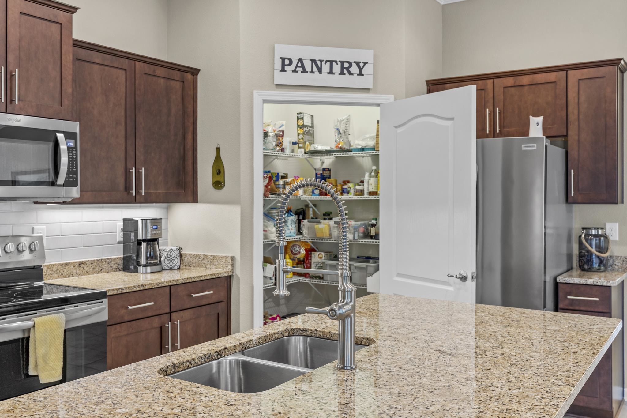 307 Palace Drive St. Augustine, FL 32084 - Photo 20 of 58 a kitchen with refrigerator and cabinets