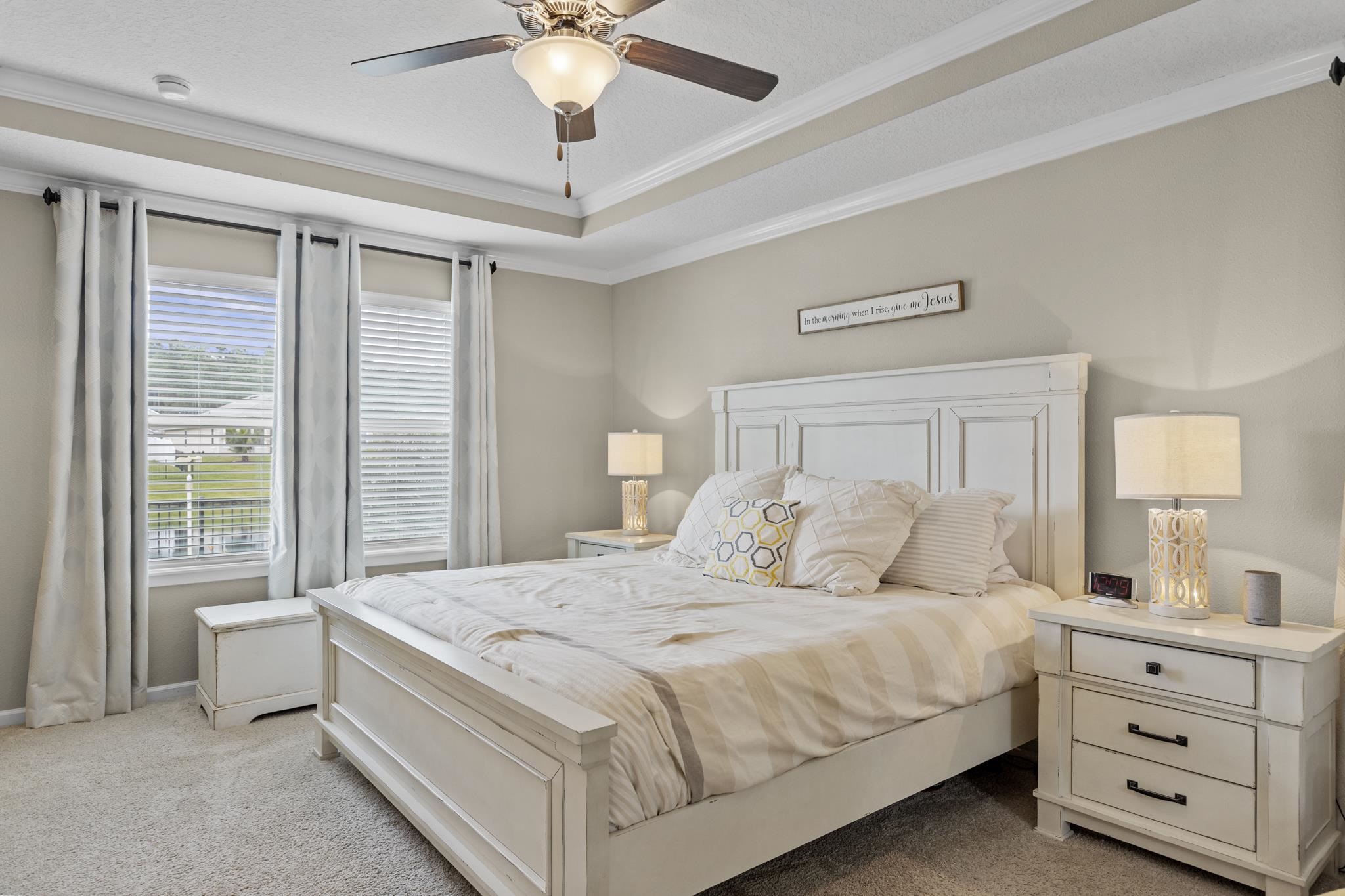 307 Palace Drive St. Augustine, FL 32084 - Photo 21 of 58 a bedroom with a large bed and a chandelier fan
