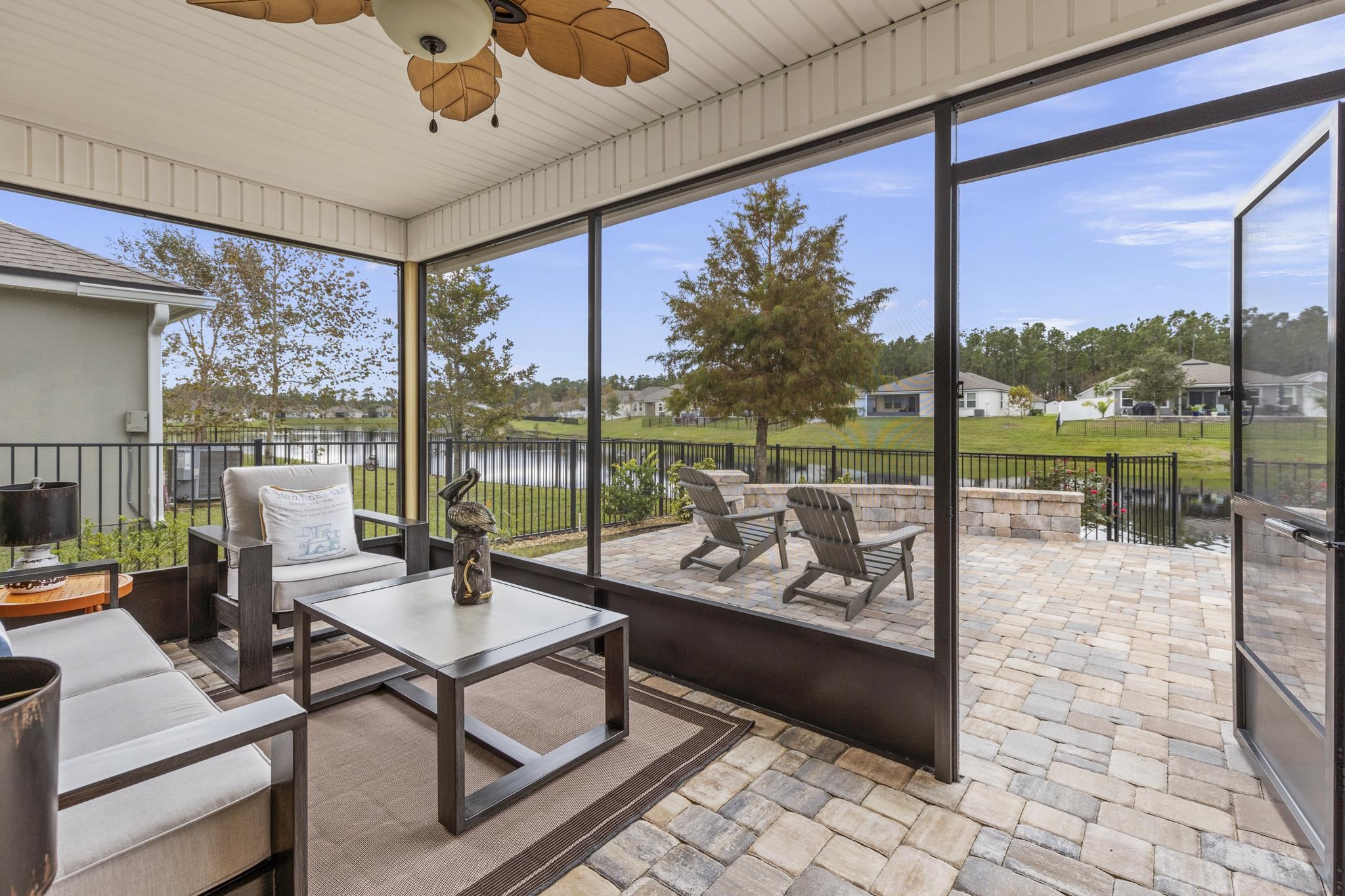 307 Palace Drive St. Augustine, FL 32084 - Photo 34 of 58 a living room with patio furniture and a garden