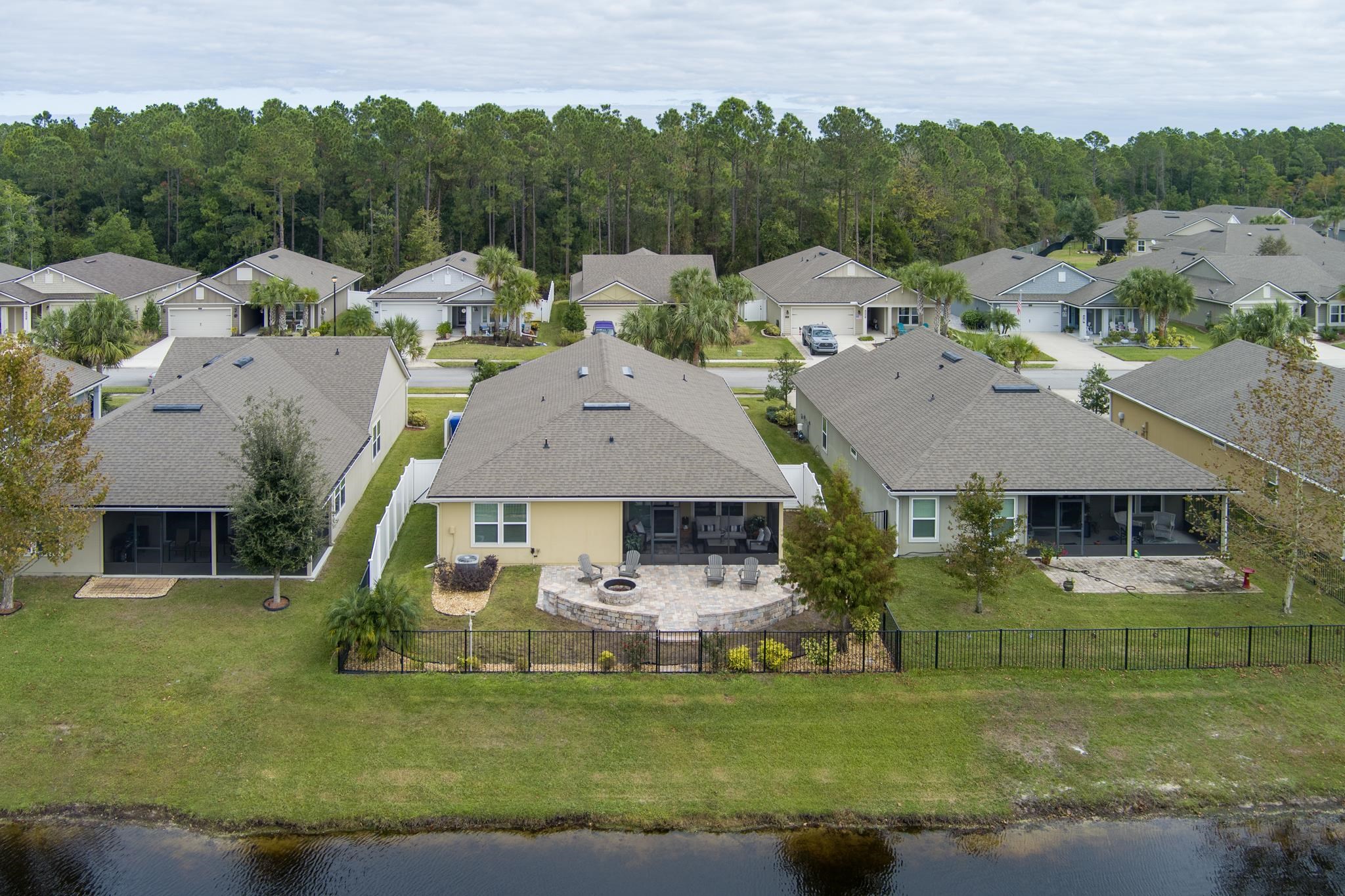 307 Palace Drive St. Augustine, FL 32084 - Photo 40 of 58 a aerial view of a house with swimming pool and a yard