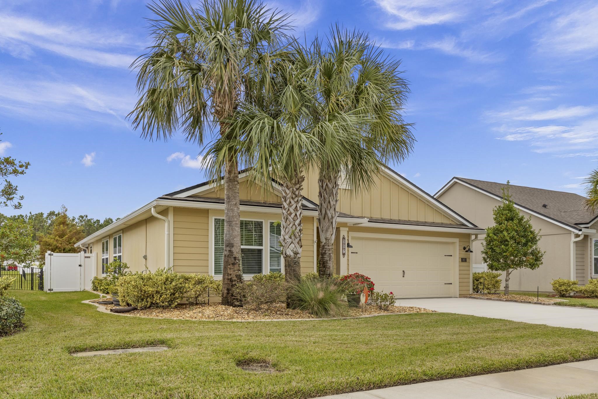 307 Palace Drive St. Augustine, FL 32084 - Photo 43 of 58 a front view of a house with garden