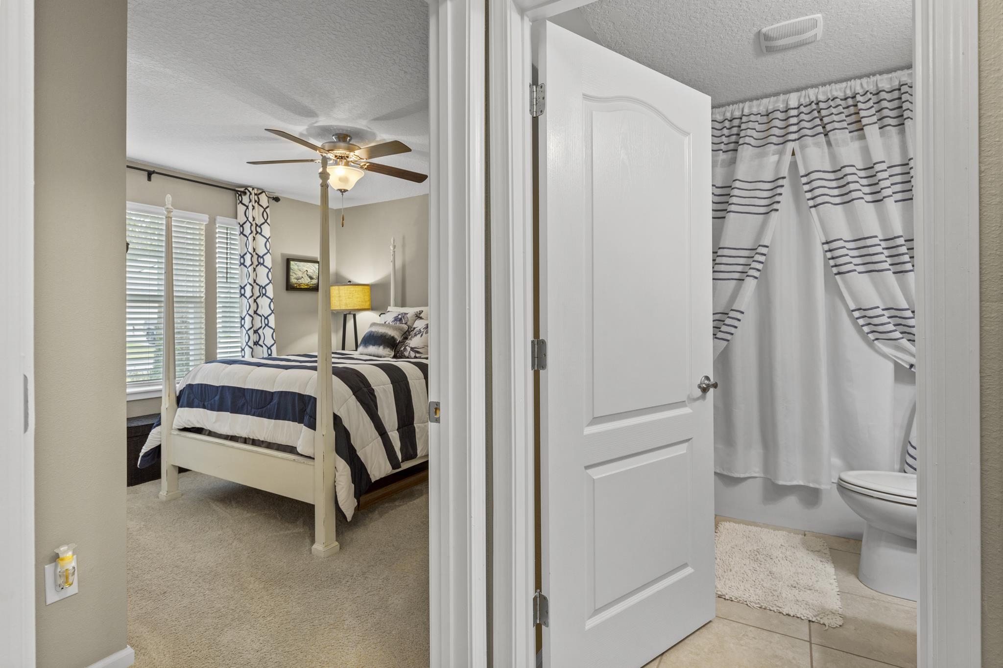 307 Palace Drive St. Augustine, FL 32084 - Photo 5 of 58 a bedroom with a bed and a window