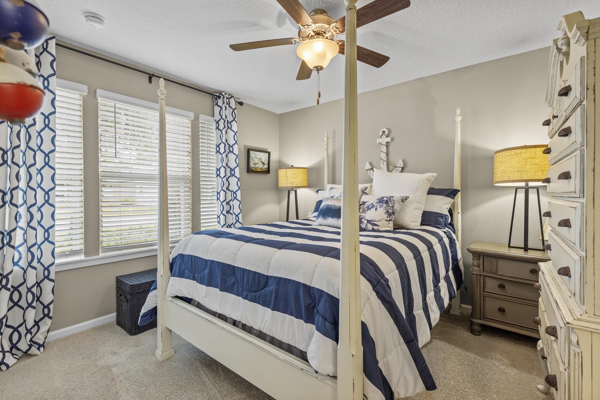 307 Palace Drive St. Augustine, FL 32084 - Photo 6 of 58 a bedroom with a bed and a chandelier