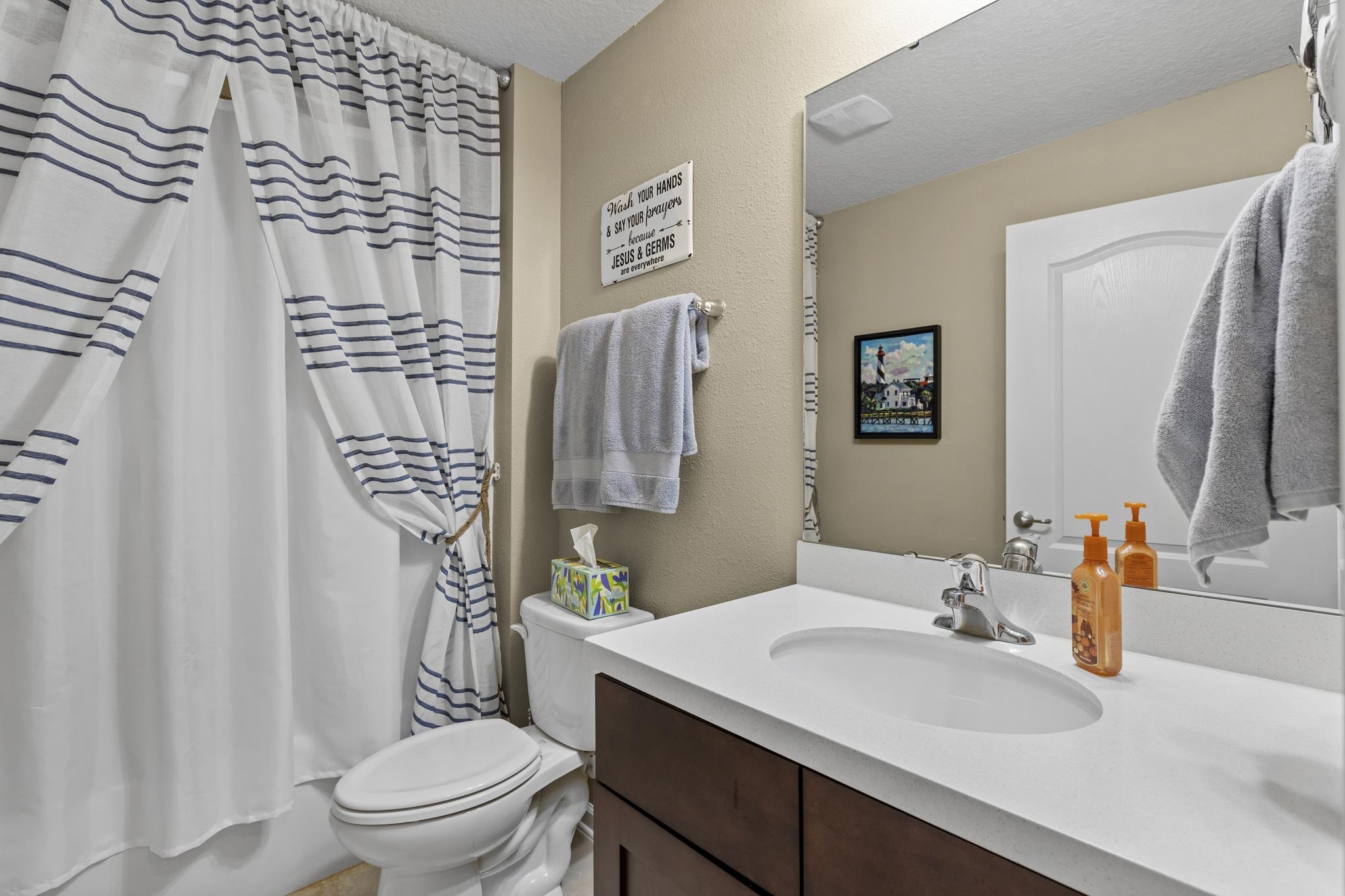 307 Palace Drive St. Augustine, FL 32084 - Photo 8 of 58 a bathroom with a sink toilet and shower