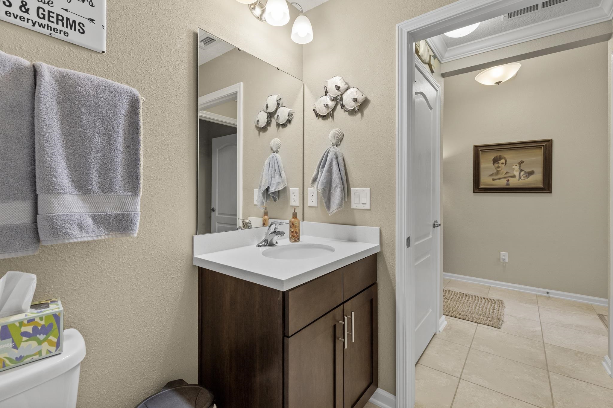 307 Palace Drive St. Augustine, FL 32084 - Photo 9 of 58 a bathroom with a sink a toilet and mirror