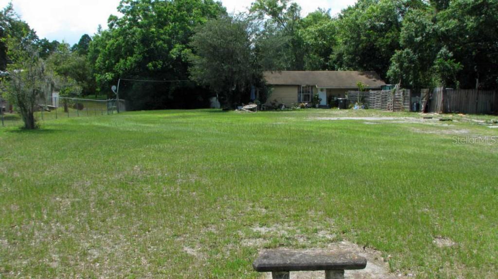 18810 Walker Road Lutz, FL 33549 - Photo 1 of 1 a view of a house with a backyard