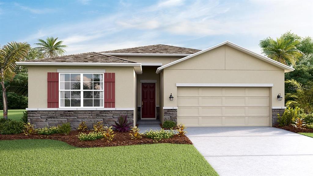 5139 Flowing Oar Road Wimauma, FL 33598 - Photo 1 of 1 a front view of a house with a yard and garage