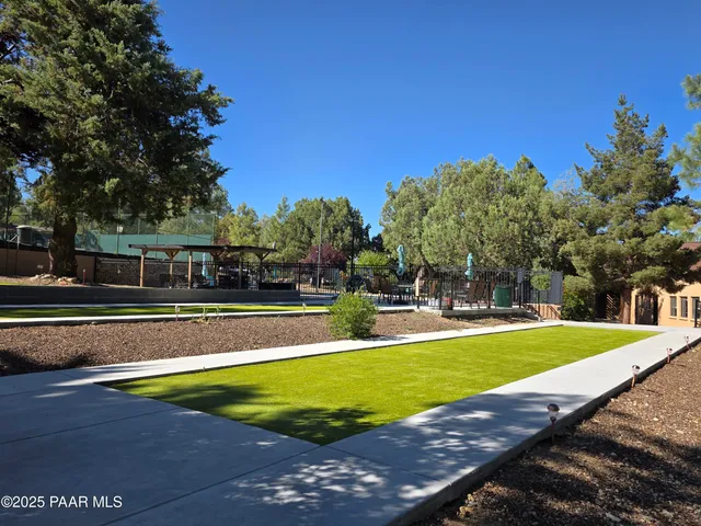 a view of a swimming pool with an outdoor space and seating area