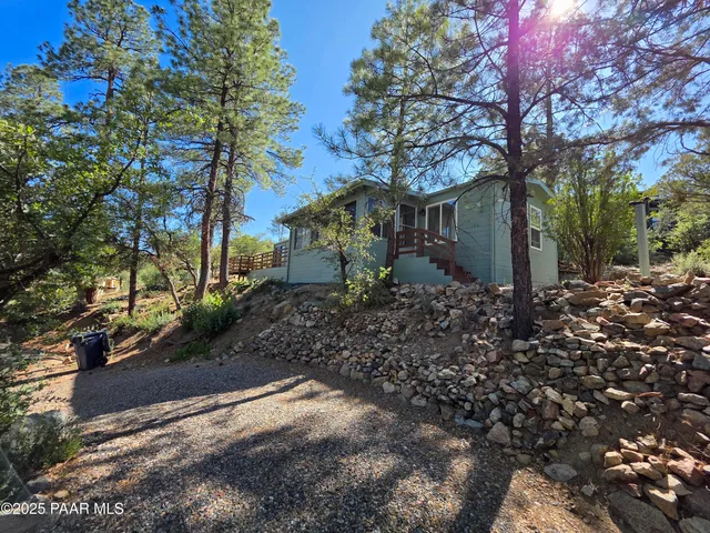 a kitchen with a refrigerator a white stove top oven and a refrigerator