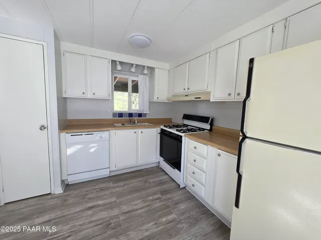 a bathroom with a toilet a sink and a shower