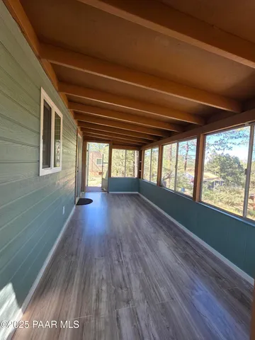 a view of balcony with wooden floor