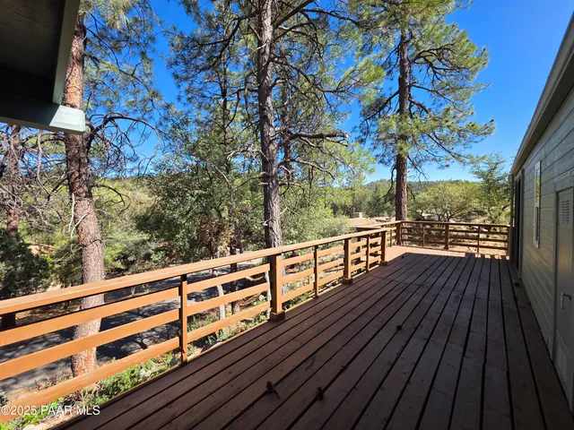 a view of balcony with wooden floor and outdoor space