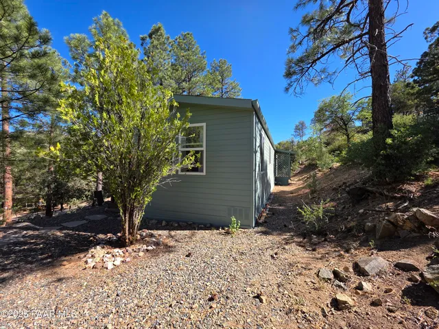 a terrace with outdoor seating and trees