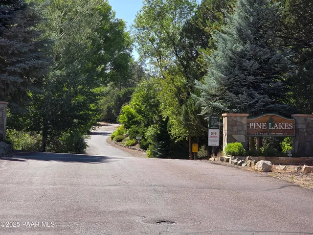 a view of a street with a car parked in front of it