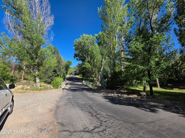 a view of a street with some trees