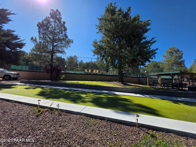 a view of a yard with a swimming pool
