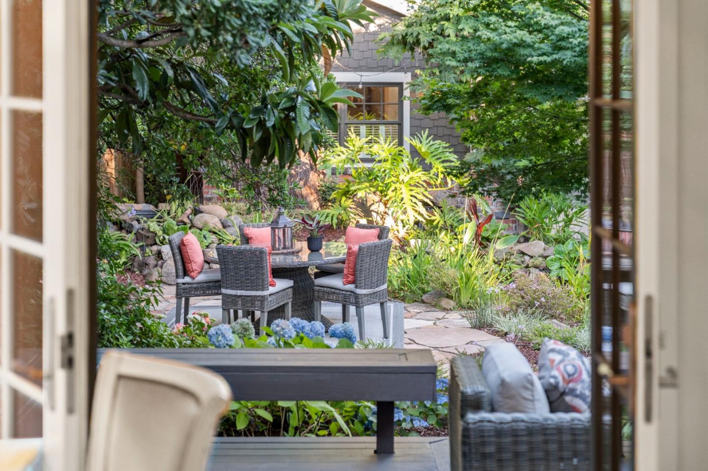 445 Arlington Road Redwood City, CA 94062 - Photo 9 of 50 a view of a patio with table and chairs and potted plants