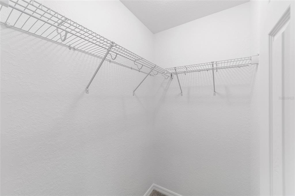 17590 Southwest 112th Place Dunnellon, FL 34432 - Photo 11 of 31 a view of a room with racks on the wall