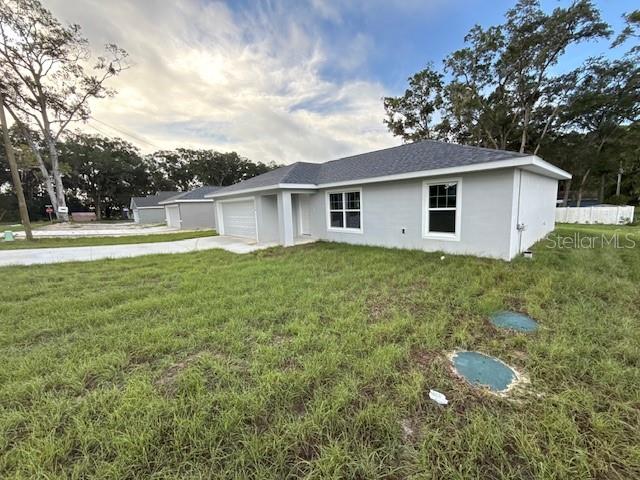 17590 Southwest 112th Place Dunnellon, FL 34432 - Photo 2 of 31 a house view with a garden space