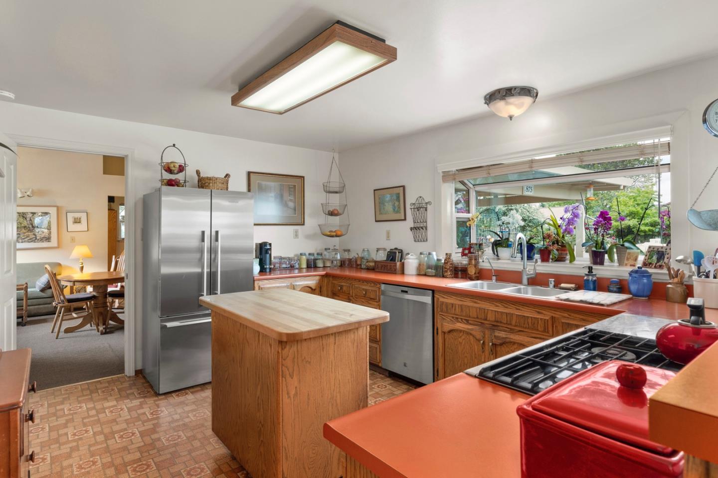 875 Amesti Road Watsonville, CA 95076 - Photo 12 of 52 a kitchen with stainless steel appliances granite countertop a sink dishwasher stove refrigerator and cabinets